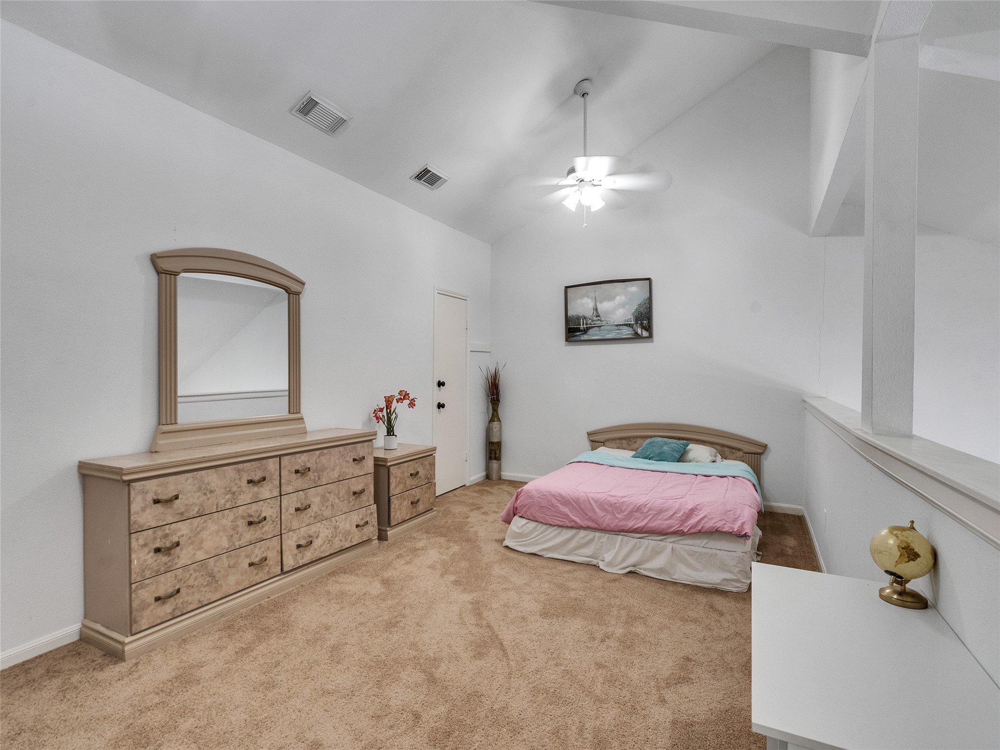 174 April Point Drive South Conroe, TX 77356 - Photo 31 of 38 a bedroom with a bed and a dresser in it
