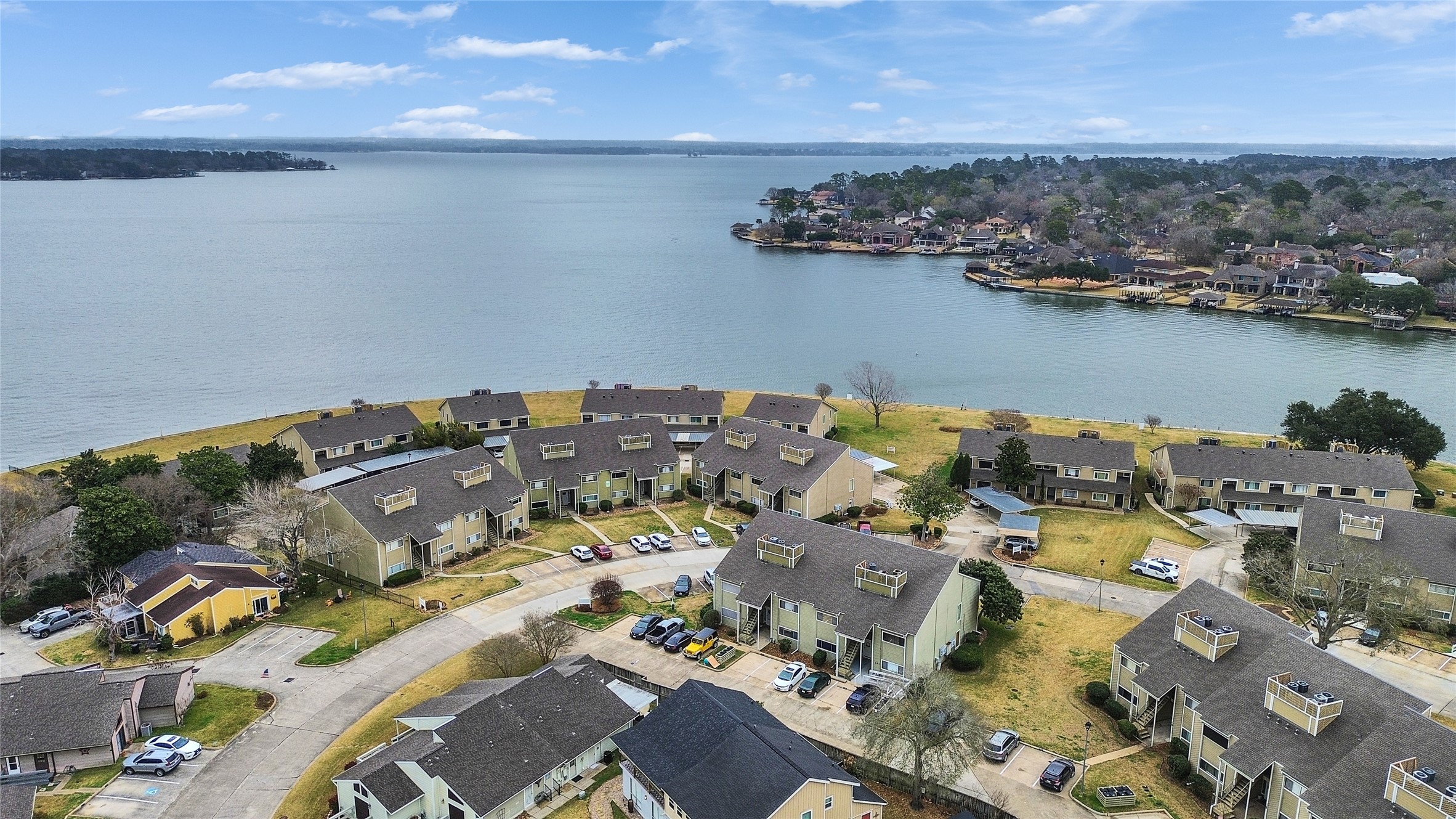 174 April Point Drive South Conroe, TX 77356 - Photo 34 of 38 an aerial view of a city with lots of residential buildings ocean and mountain view in back