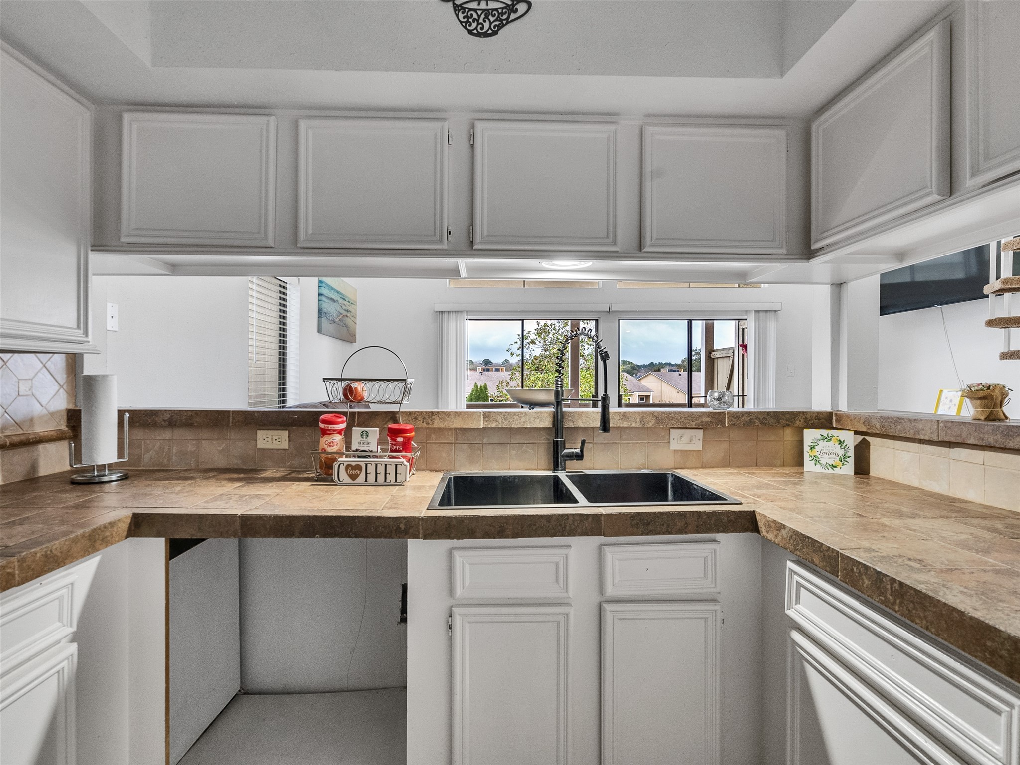 174 April Point Drive South Conroe, TX 77356 - Photo 6 of 38 a kitchen with granite countertop a sink and cabinets