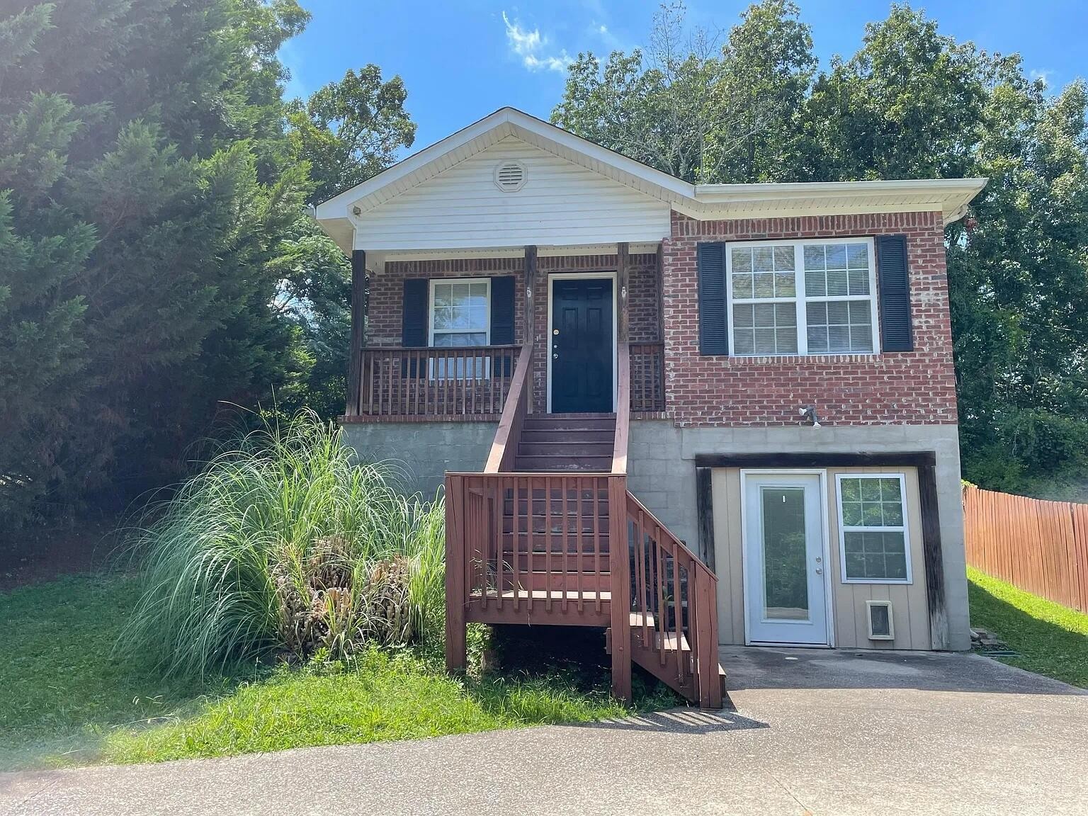 322 Signal Drive Rossville, GA 30741 - Photo 2 of 17 a front view of a house with a garden
