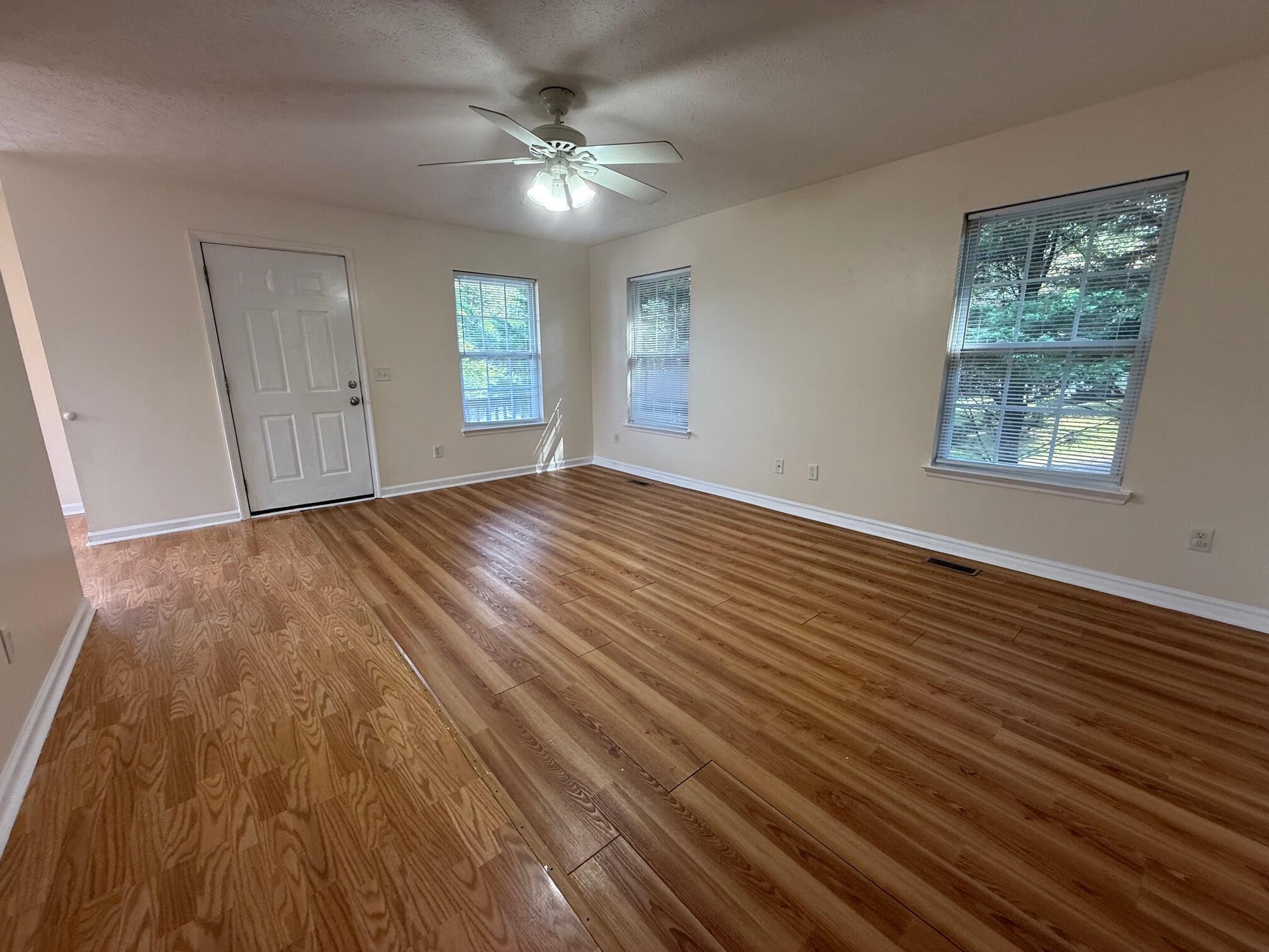 322 Signal Drive Rossville, GA 30741 - Photo 6 of 17 a view of an empty room with wooden floor and a window