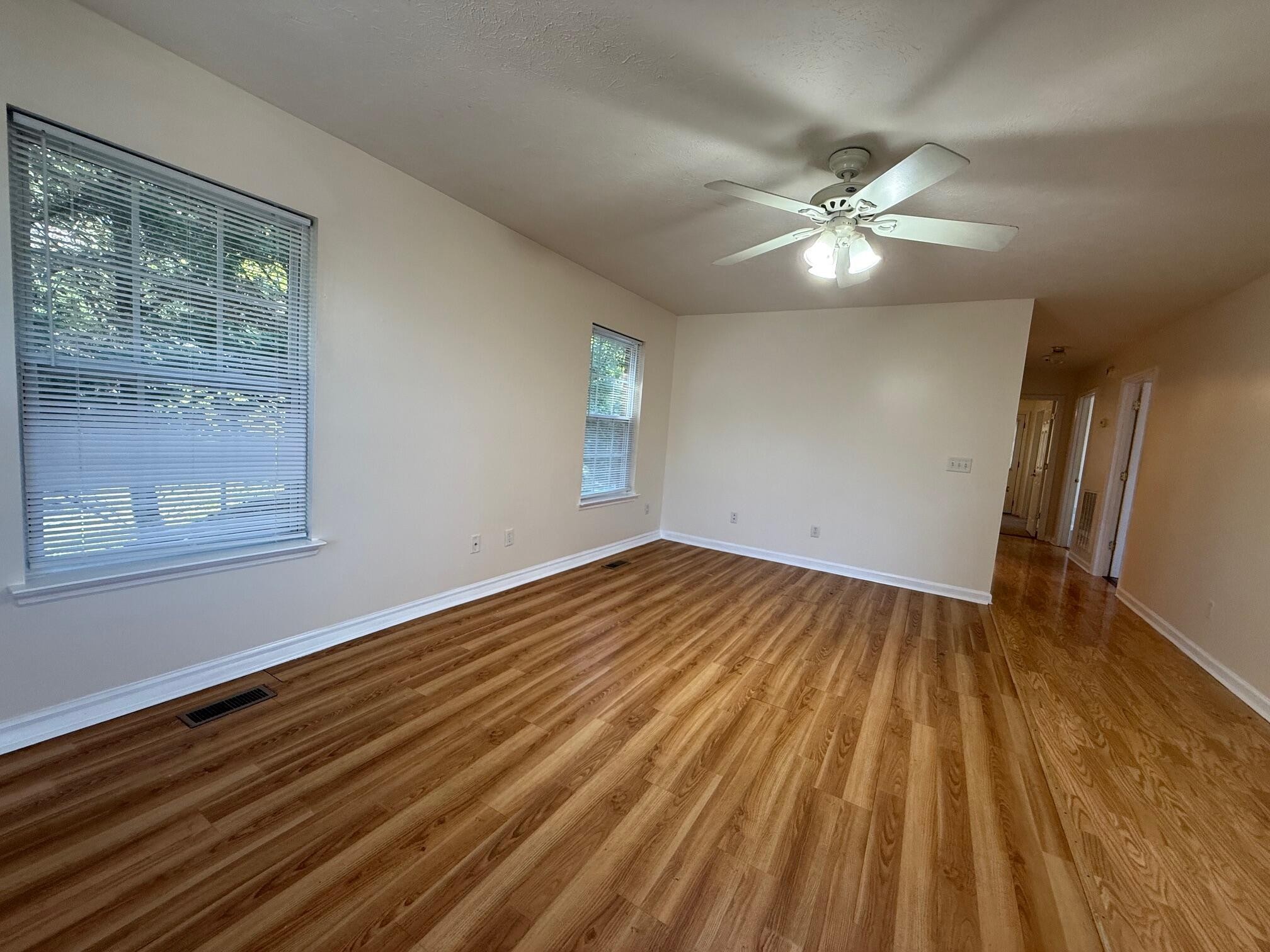 322 Signal Drive Rossville, GA 30741 - Photo 8 of 17 a view of empty room with wooden floor and fan