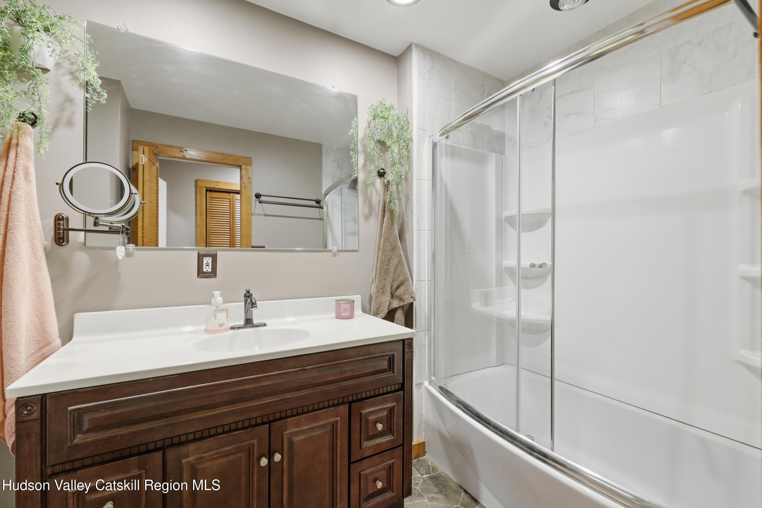 186 Cedar Hill Road High Falls, NY 12440 - Photo 22 of 33 a bathroom with a double vanity sink mirror and shower