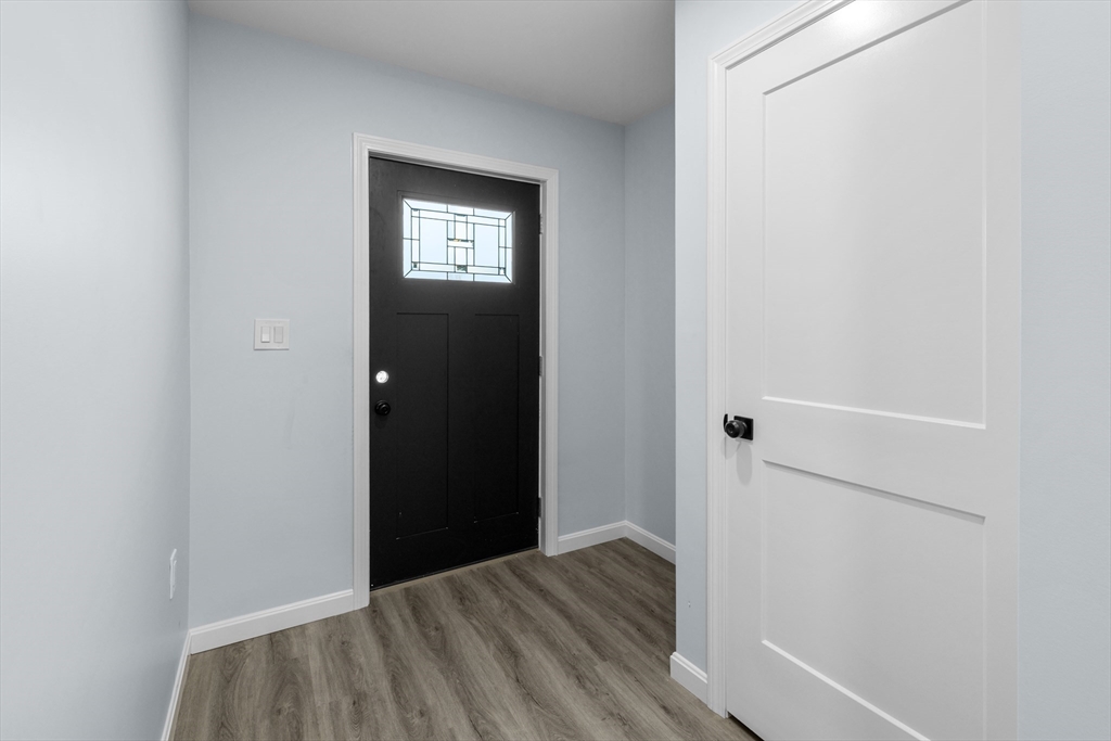81 Hunter Street Fall River, MA 02721 - Photo 12 of 15 a view of a hallway with wooden floor