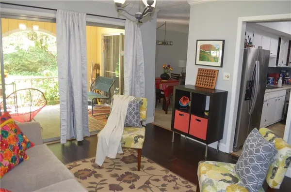 a living room filled with furniture and a window