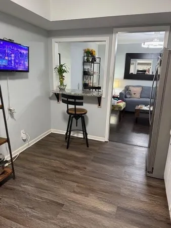 a view of a livingroom with furniture and wooden floor