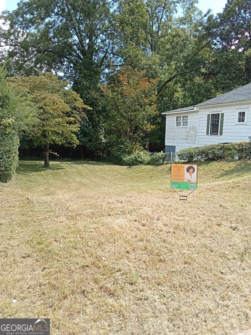 942 Dewey Street Southwest Atlanta, GA 30310 - Photo 1 of 7 a view of a house with pool and trees around