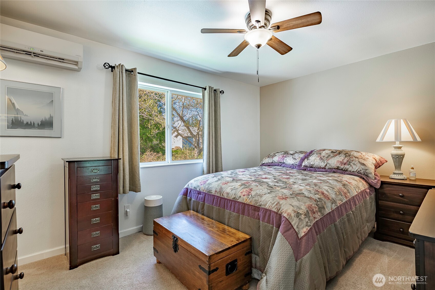 8209 Comox Road Birch Bay, WA 98230 - Photo 12 of 25 a bedroom with a bed and a chandelier