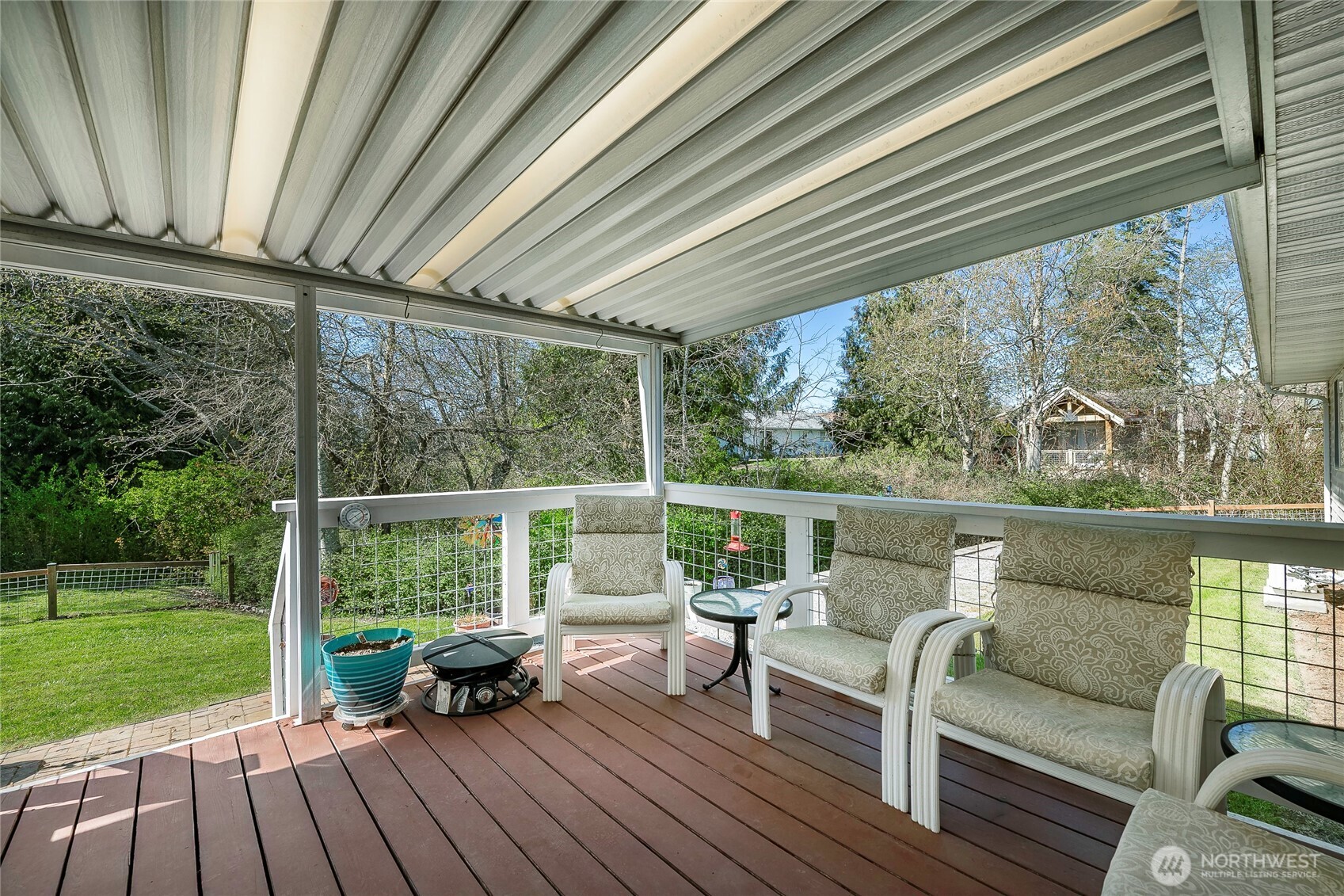 8209 Comox Road Birch Bay, WA 98230 - Photo 15 of 24 a balcony with wooden floor and outdoor seating