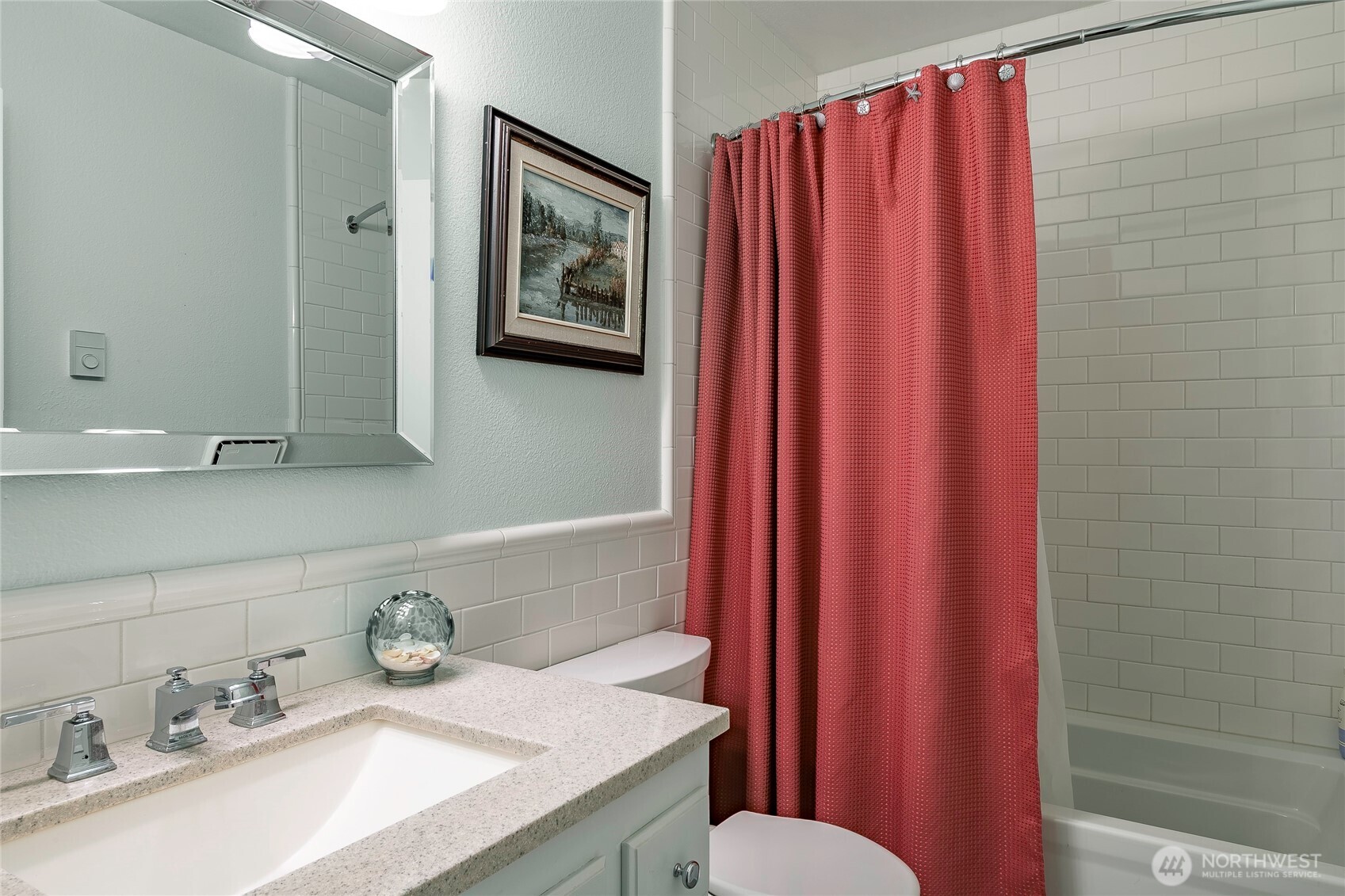 8209 Comox Road Birch Bay, WA 98230 - Photo 8 of 24 a bathroom with a sink vanity mirror and toilet