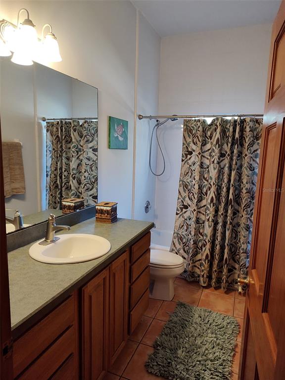 1045 Buckles Road Pierson, FL 32180 - Photo 13 of 25 a bathroom with a sink toilet and shower