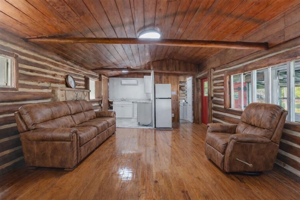 1045 Buckles Road Pierson, FL 32180 - Photo 15 of 19 a living room with furniture and wooden floor