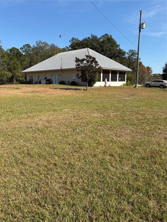 1045 Buckles Road Pierson, FL 32180 - Photo 20 of 25 a view of a house with a big yard