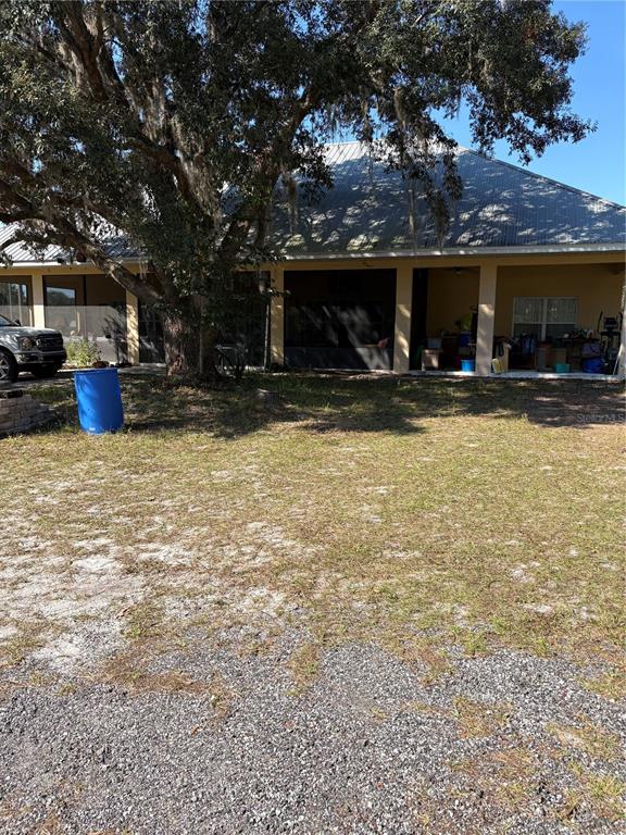 1045 Buckles Road Pierson, FL 32180 - Photo 2 of 25 a view of a house with backyard porch and sitting area