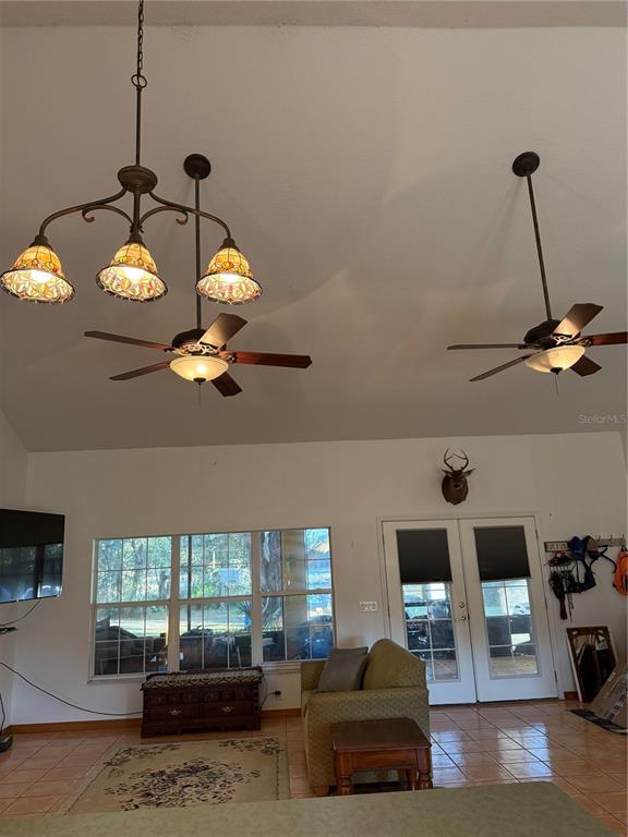 1045 Buckles Road Pierson, FL 32180 - Photo 10 of 25 a living room with furniture and a chandelier