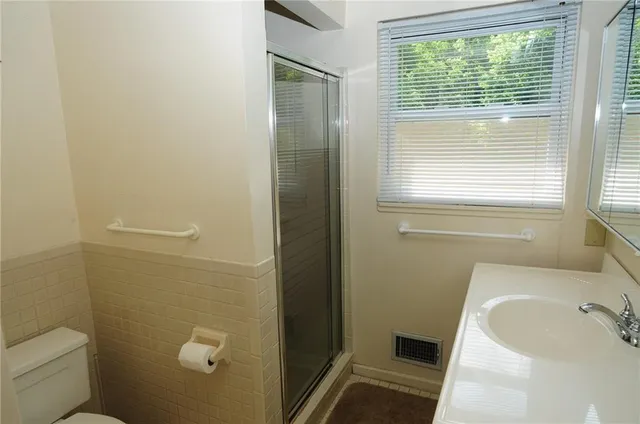 a view of a wooden deck with a bench