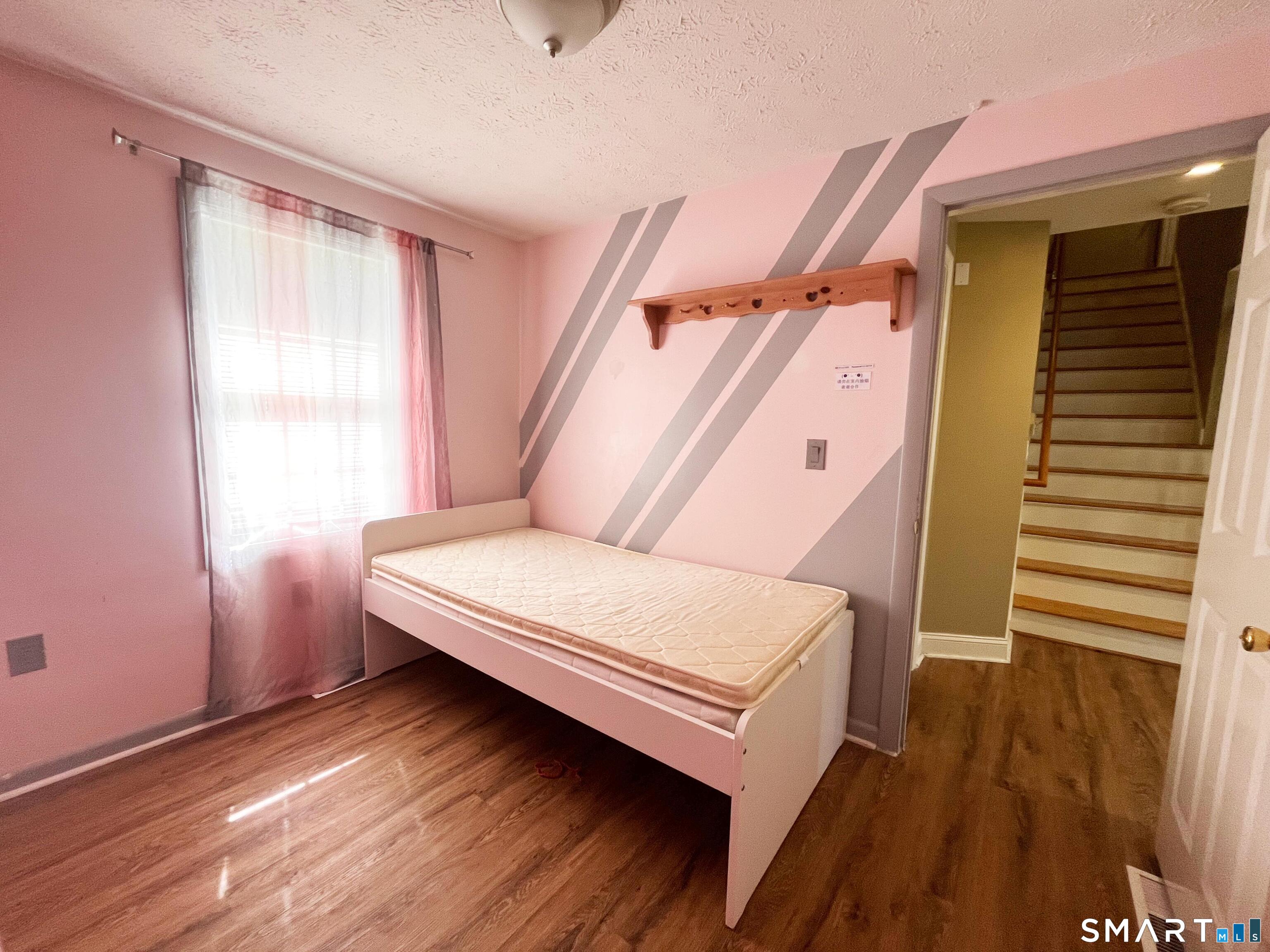52 Monce Road Burlington, CT 06013 - Photo 14 of 26 a bedroom with a bed and a window