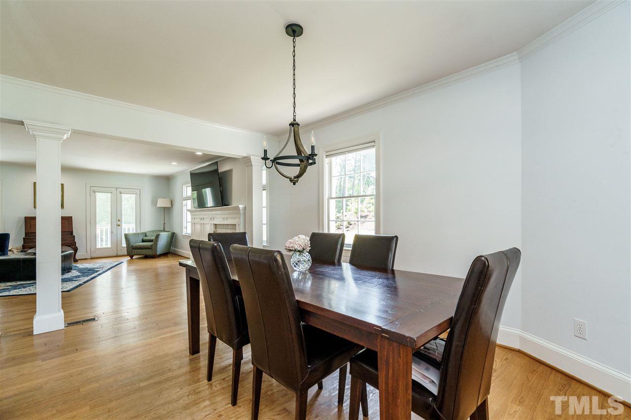 1001 Canterbury Road Raleigh, NC 27607 - Photo 13 of 29 a view of a dining room with furniture window and wooden floor