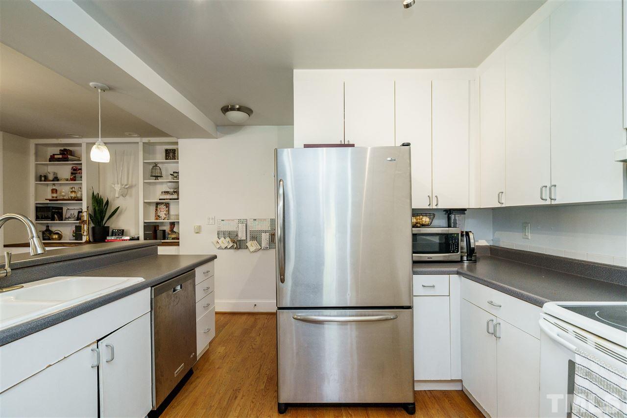 1001 Canterbury Road Raleigh, NC 27607 - Photo 15 of 29 a kitchen with stainless steel appliances a refrigerator and a sink