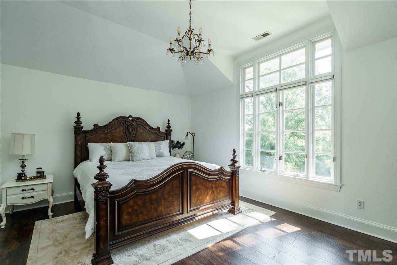 1001 Canterbury Road Raleigh, NC 27607 - Photo 16 of 29 a bedroom with a bed and a window