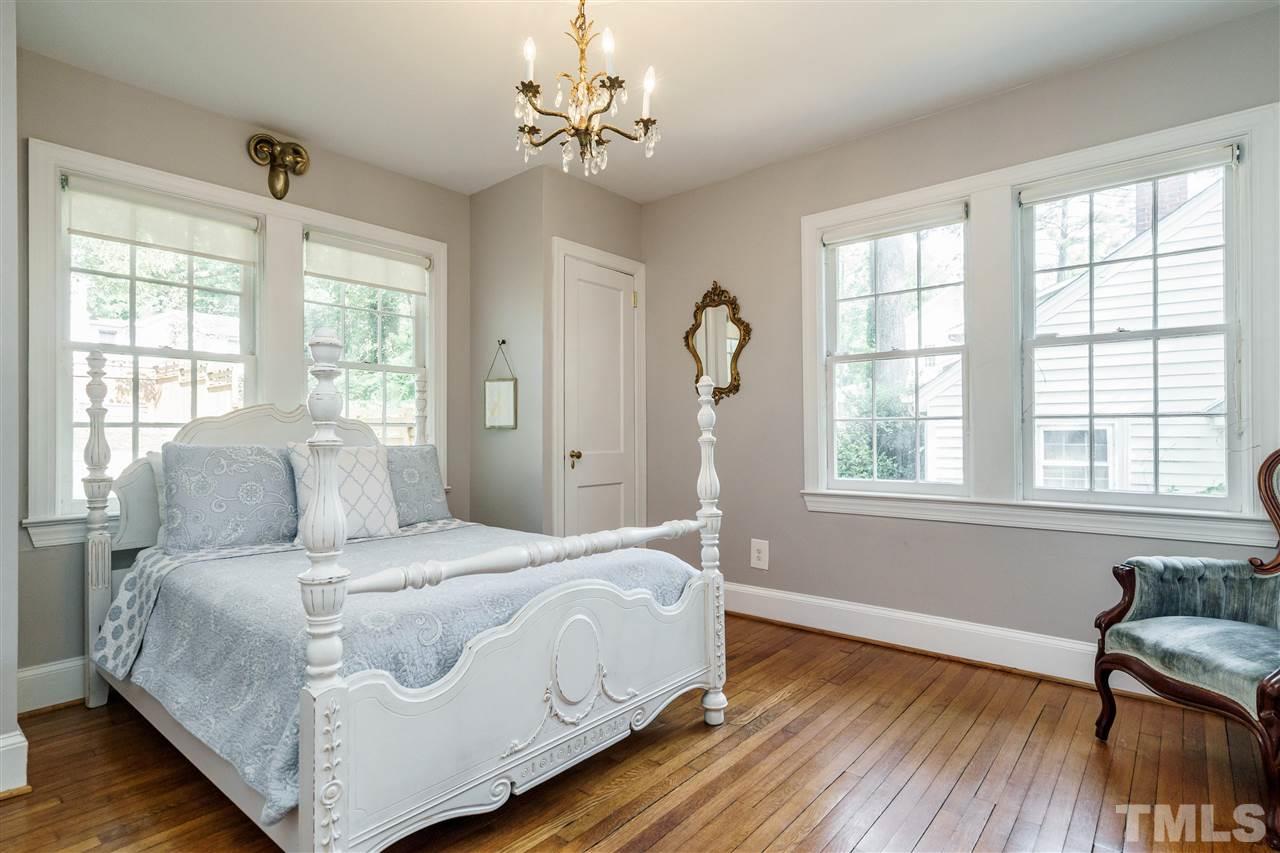 1001 Canterbury Road Raleigh, NC 27607 - Photo 17 of 29 a bedroom with a large bed and a window