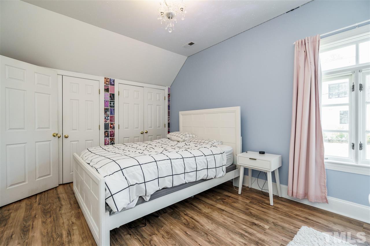 1001 Canterbury Road Raleigh, NC 27607 - Photo 19 of 29 a bedroom with a bed and a window