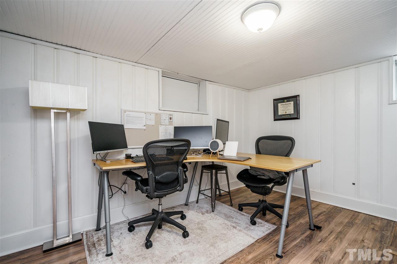 1001 Canterbury Road Raleigh, NC 27607 - Photo 22 of 29 a view of a workspace with furniture and a chair