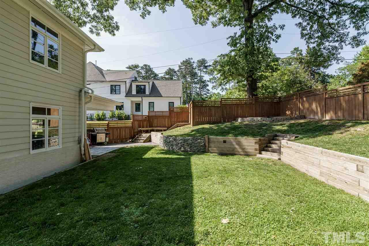 1001 Canterbury Road Raleigh, NC 27607 - Photo 27 of 29 a view of a house with a yard and sitting area