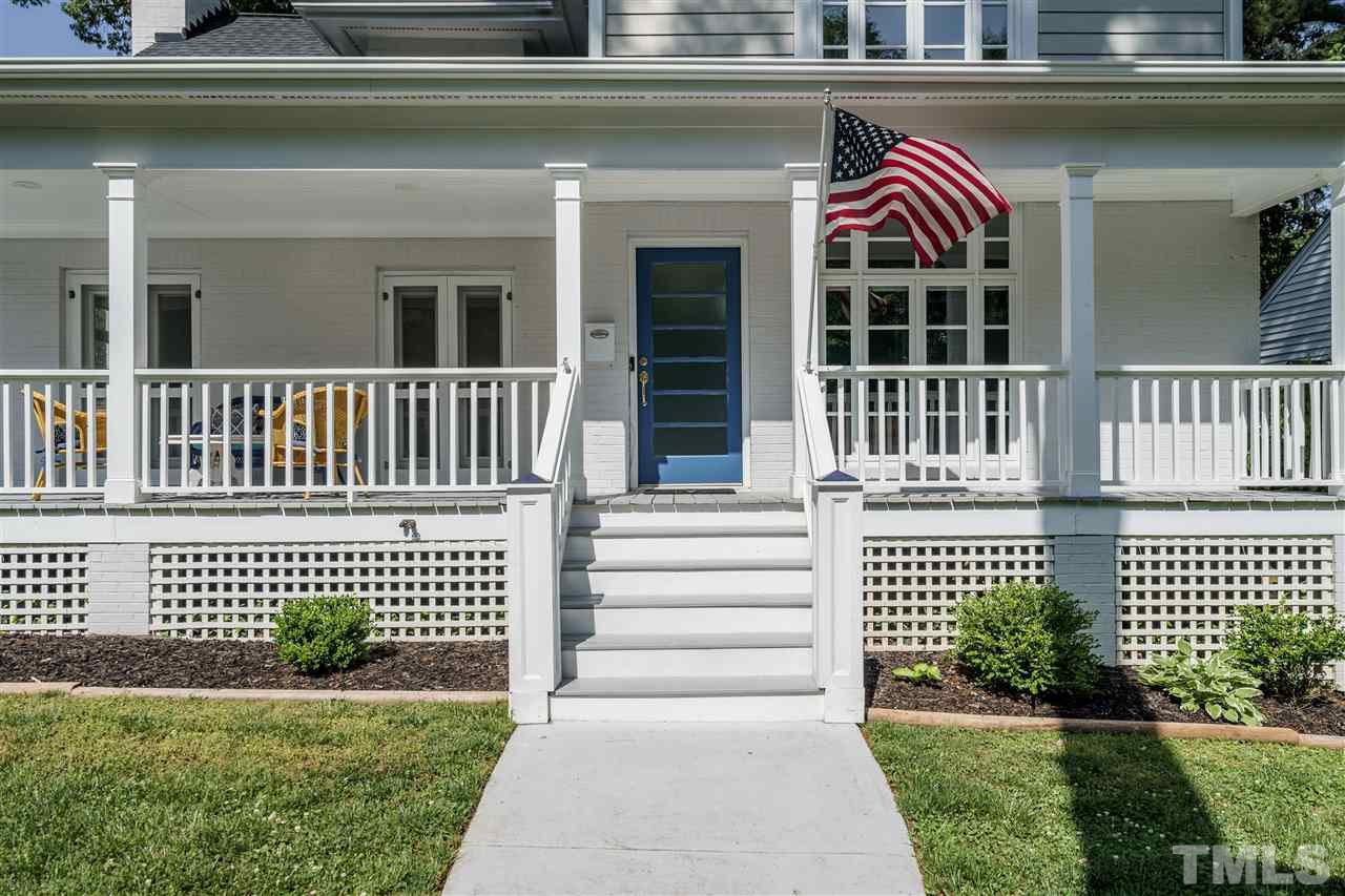 1001 Canterbury Road Raleigh, NC 27607 - Photo 4 of 29 a view of a house with a small deck and a garden