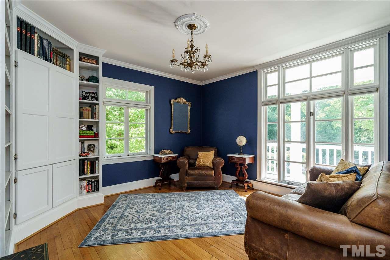 1001 Canterbury Road Raleigh, NC 27607 - Photo 8 of 29 a living room with furniture windows and wooden floor