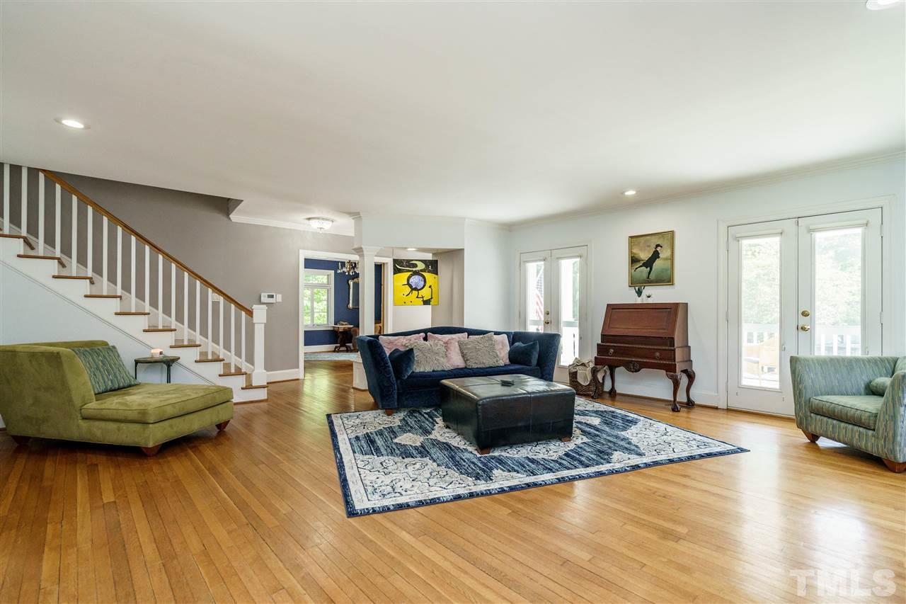1001 Canterbury Road Raleigh, NC 27607 - Photo 10 of 29 a living room with furniture and a wooden floor