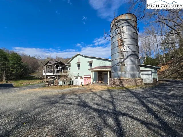 a view of a house with outdoor space and sitting area