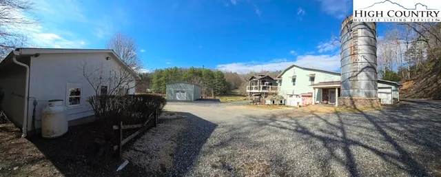 a view of a house with basketball court