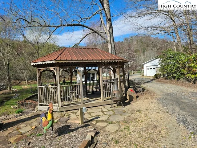 a view of a chair and table in the patio