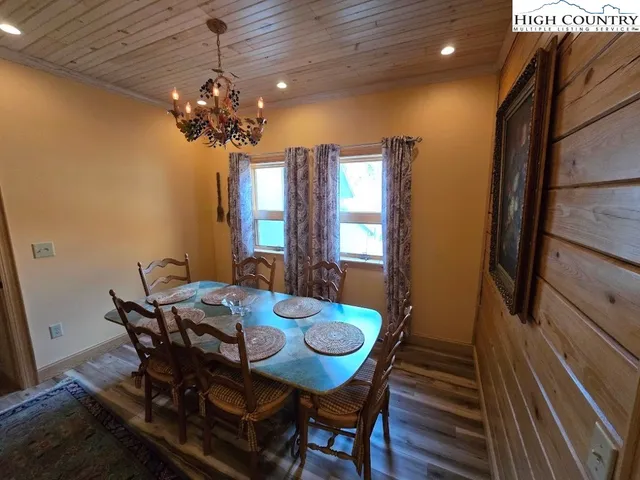 a view of a dining room with furniture and window