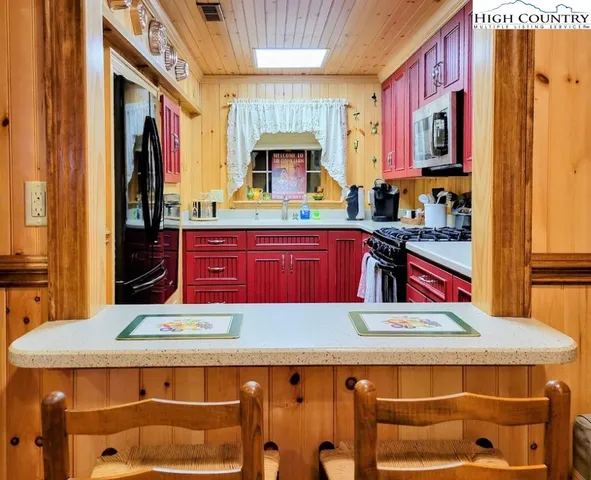 a kitchen that has a lot of cabinets in it