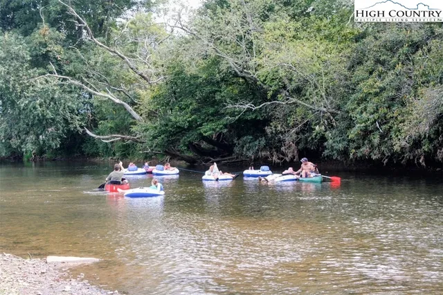 a view of swimming pool with a table