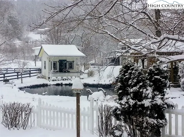 a view of a room with wooden floor and outdoor seating