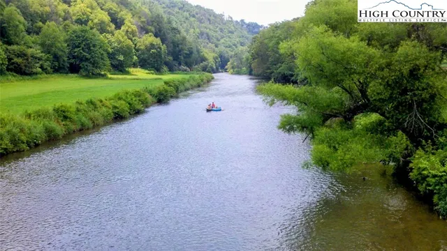a view of a street with a bench in back