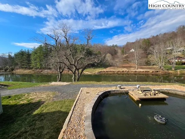 a view of a lake with a yard