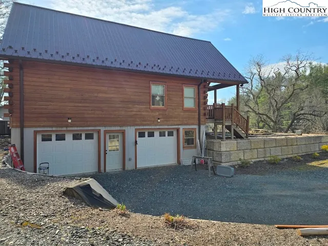 a backyard of a house with a yard and garage