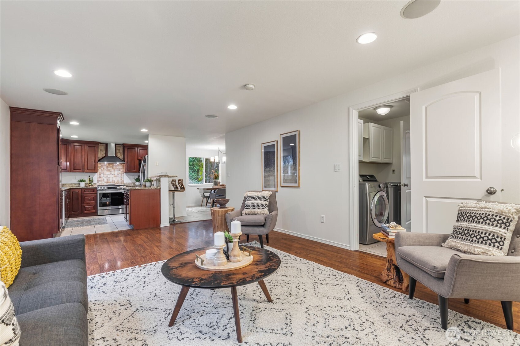 6107 South Fountain Street Seattle, WA 98178 - Photo 11 of 29 a living room with furniture and a dining table with kitchen view