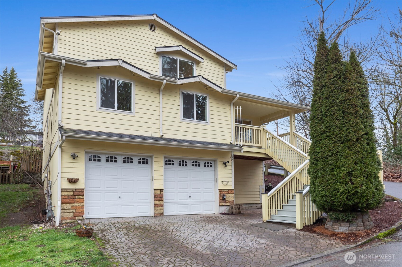 6107 South Fountain Street Seattle, WA 98178 - Photo 2 of 29 a front view of a house with a garage