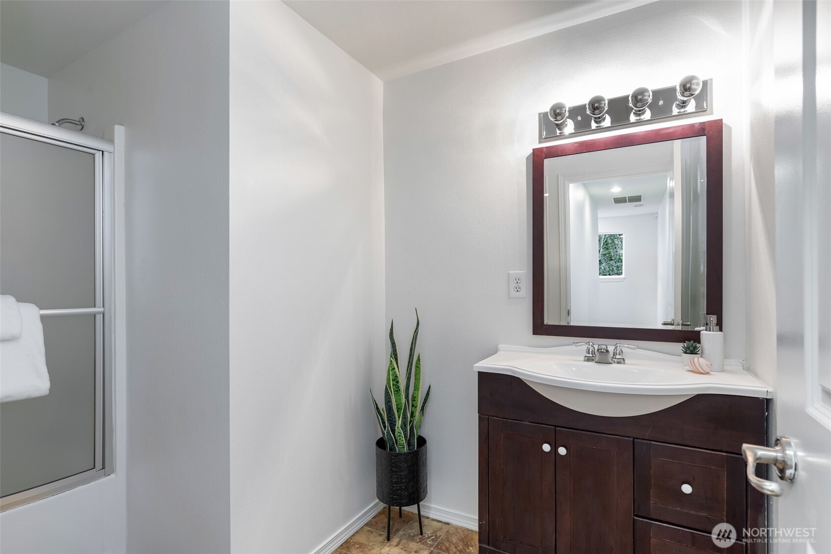 6107 South Fountain Street Seattle, WA 98178 - Photo 22 of 29 a bathroom with a sink and a mirror