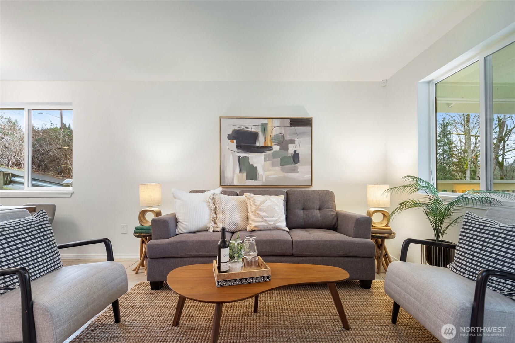 6107 South Fountain Street Seattle, WA 98178 - Photo 3 of 29 a living room with furniture and a potted plant on table