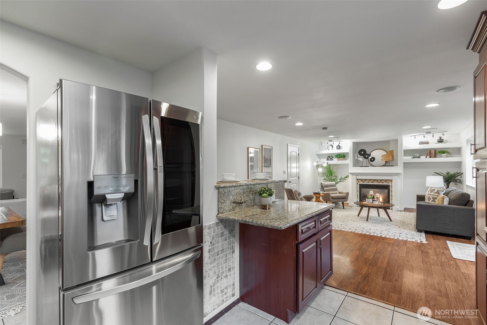 6107 South Fountain Street Seattle, WA 98178 - Photo 8 of 29 a kitchen with stainless steel appliances granite countertop a refrigerator stove and oven
