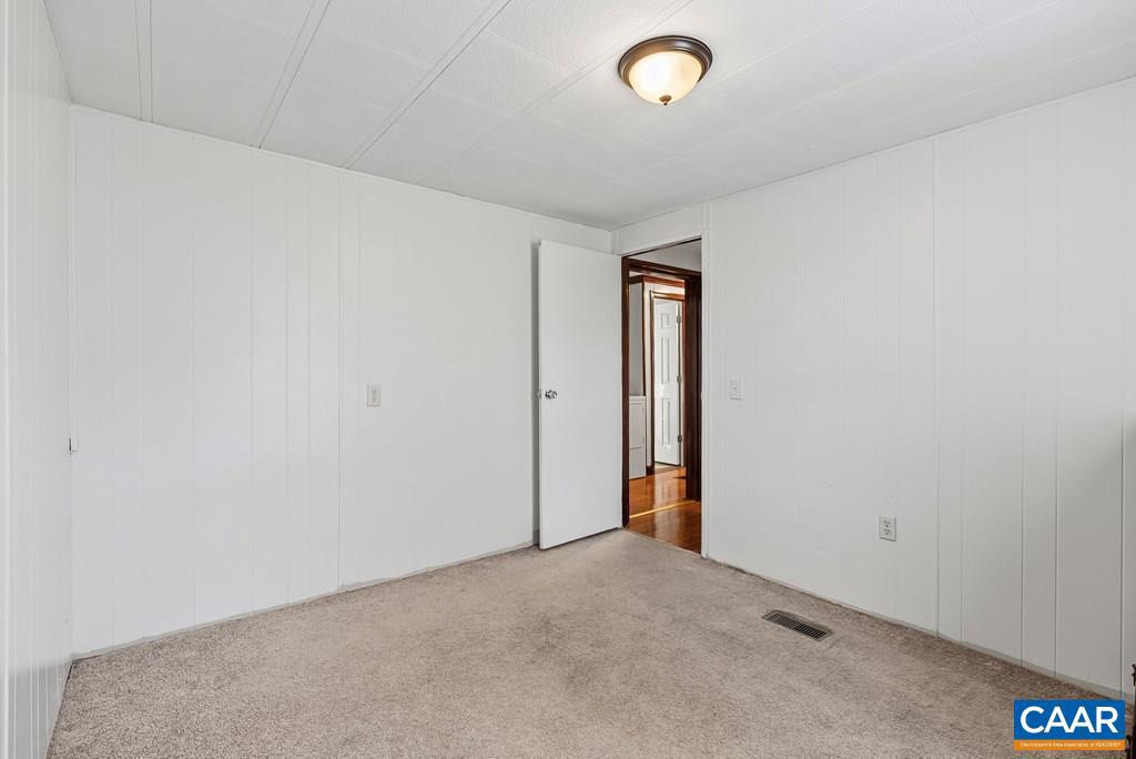 1066 Stevens Cove Road Lovingston, VA 22949 - Photo 19 of 34 an empty room with a empty space