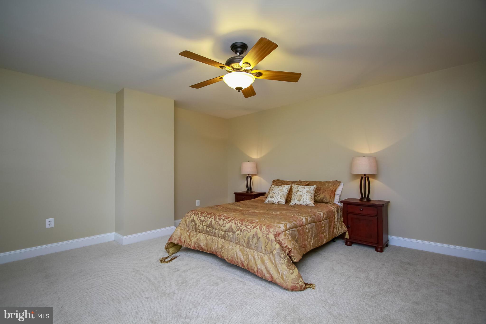930 Litchfield Road Baltimore, MD 21239 - Photo 14 of 24 a bedroom with a bed and a ceiling fan