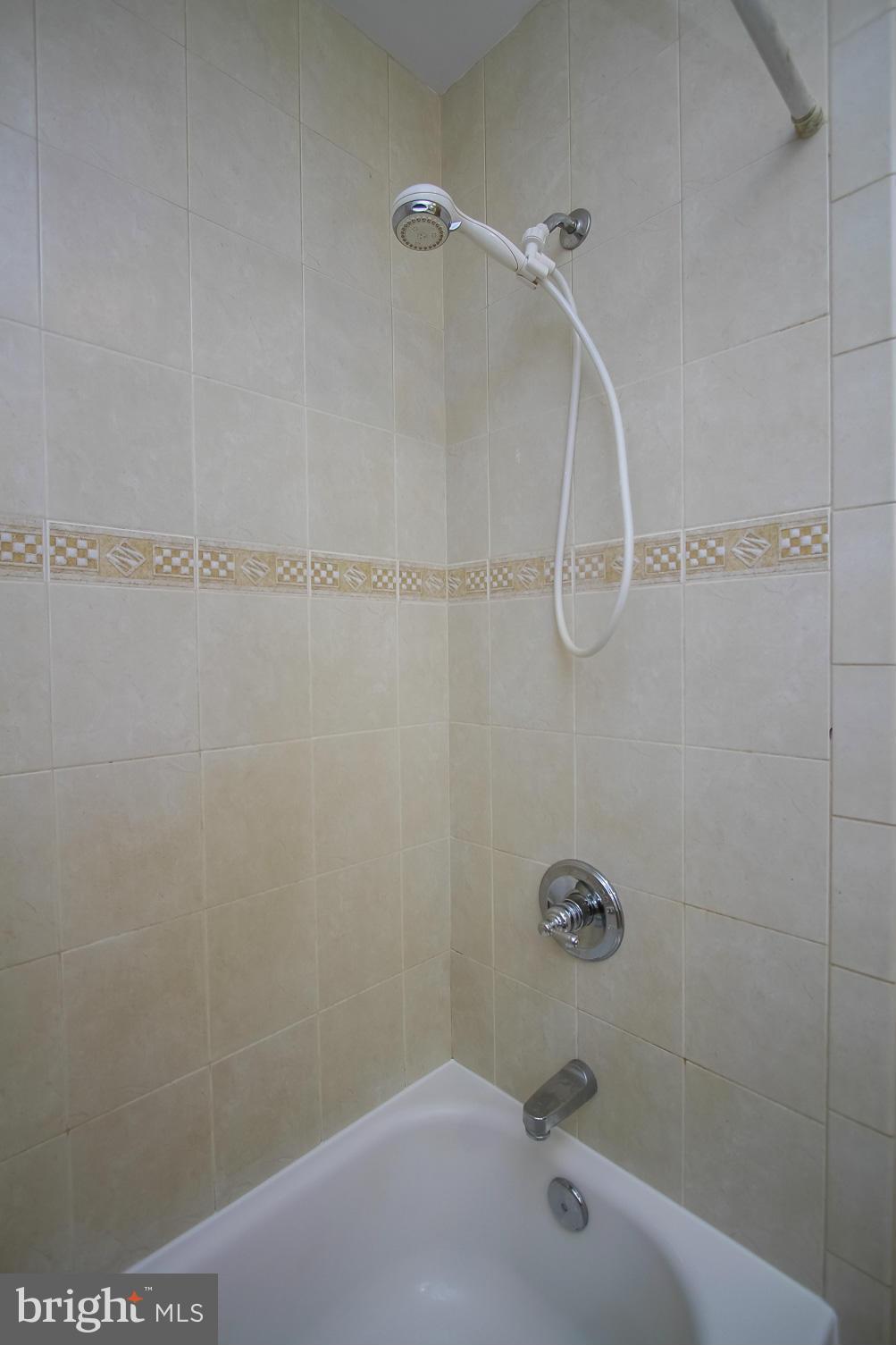 930 Litchfield Road Baltimore, MD 21239 - Photo 16 of 24 a bathroom with a shower and a bathtub