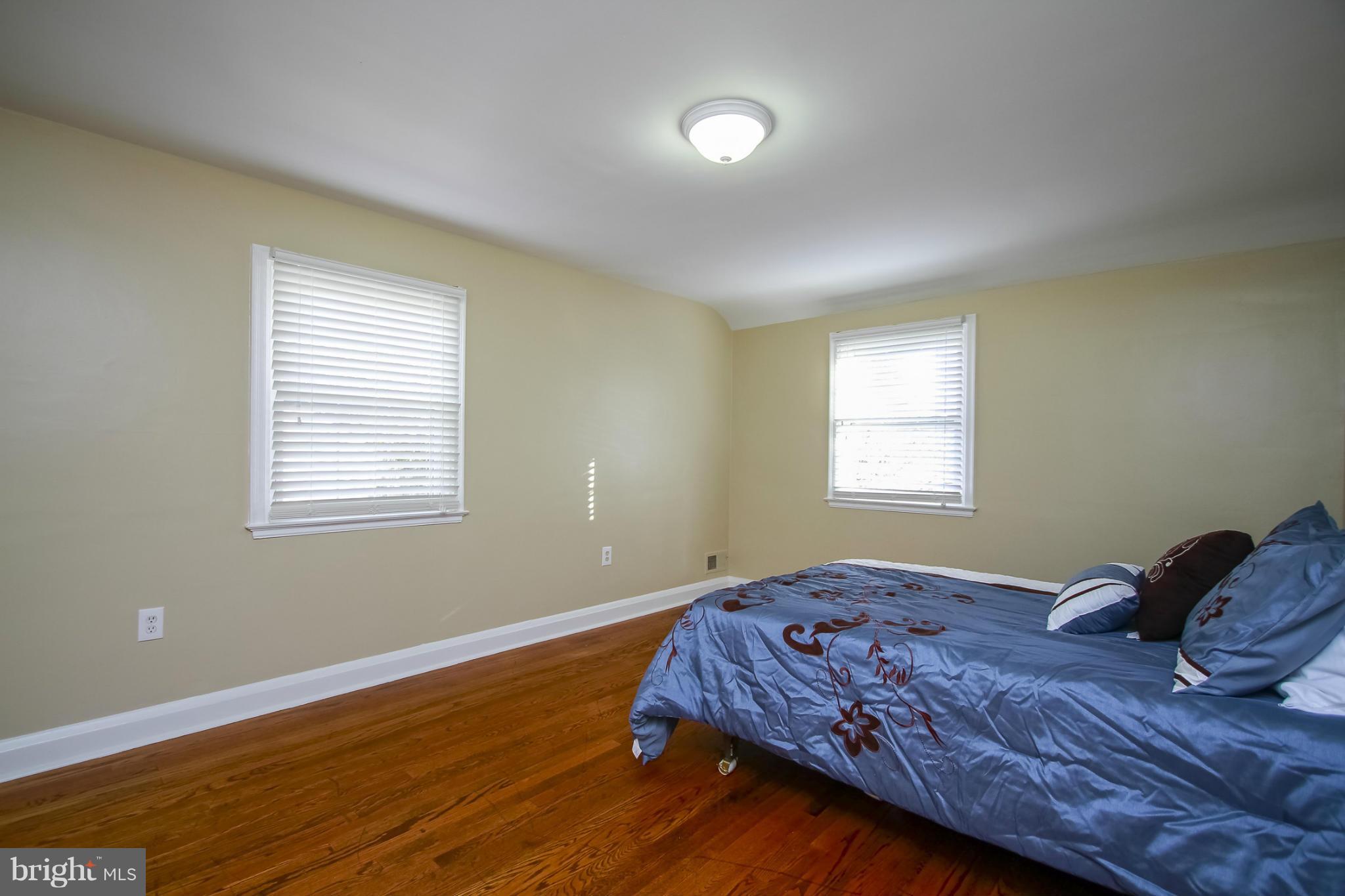 930 Litchfield Road Baltimore, MD 21239 - Photo 18 of 24 a bedroom with bed and window